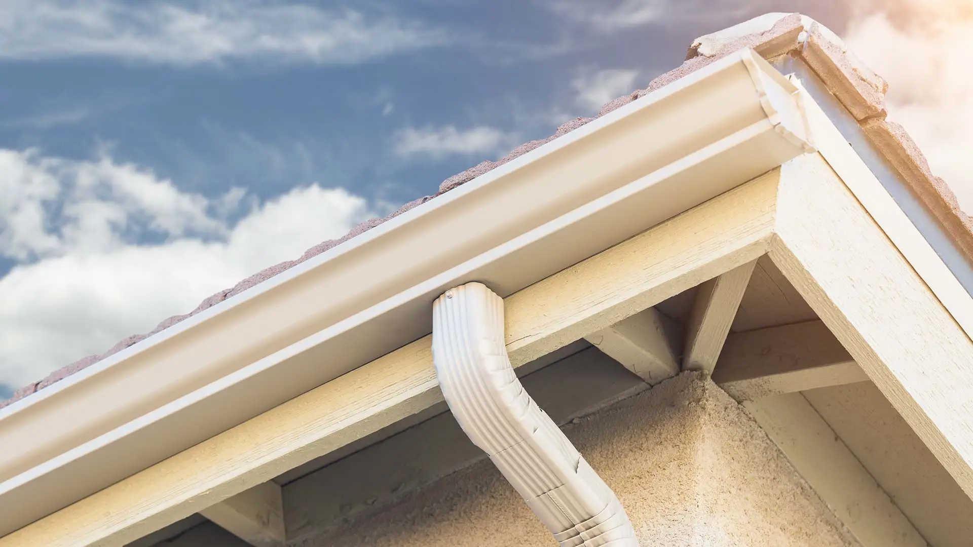 Roofline gutter and downspout on a Central Florida home serviced by True Roofers